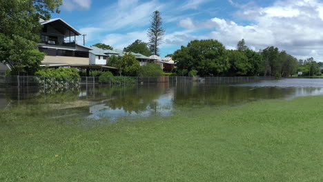 4k-Aerial-shot-over-a-flooded-neighborhood-in-the-town-Murwillumbah,-Australia