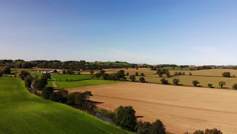 Aerial-Over-Idyllic-Patchwork-East-Devon-Farmland-Countryside-Near-Honiton