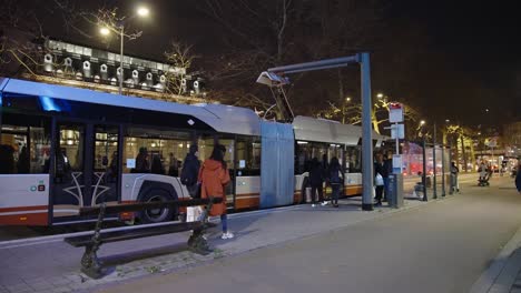 Electric-bus-charging-renewable-energy-at-the-station-in-the-evening