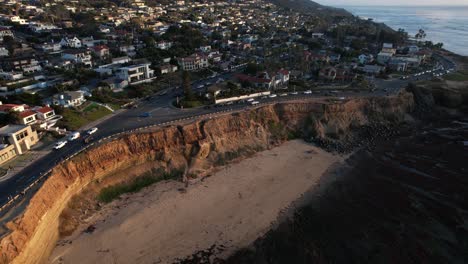 Sunset-Cliffs-Beach-and-Residential-Neighborhood,-San-Diego-CA-USA,-Aerial-View-of-Sunny-Coast-and-Boulevard-Traffic,-Revealing-Drone-Shot