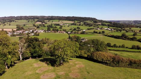Aerial-parallax-shot-of-the-East-Devon-Countryside-on-a-beautiful-summers-day