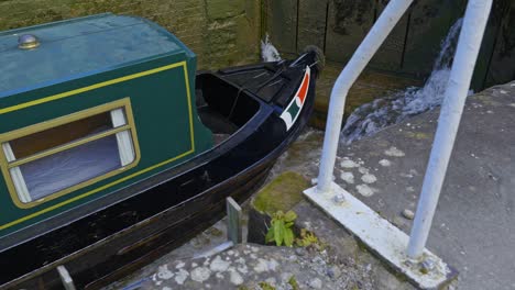 Metal-wall-laddders-attched-to-canal-lock-system-for-egress-and-access-safety-down-to-deck-of-narrowboat