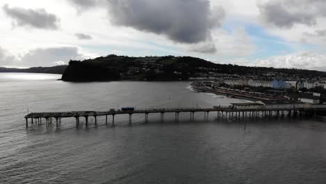 Aerial-View-Of-Teignmouth's-Grand-Pier,-Town-And-Shaldon