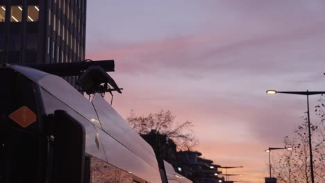 Electric-bus-charging-renewable-electricity-at-beautiful-sunset