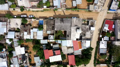 Aerial-view-of-Oaxaca's-poor-neighbourhood-filmed-by-a-drone-with-top-down-displacement,-showing-shack-homes-and-empty-streets