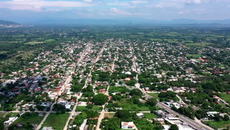 Aerial-wide-view-of-the-suburbs-of-the-city-of-Oaxaca-in-Mexico,-filmed-by-a-drone-with-horizontal-displacement