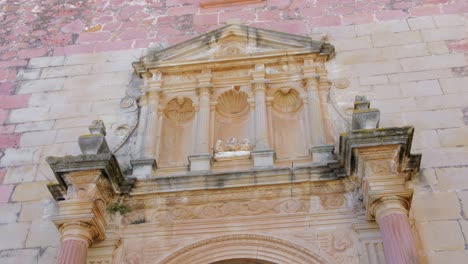 Assumption-Church-Main-Facade-in-Vilafames,-Castellon,-Spain---low-angle-shot