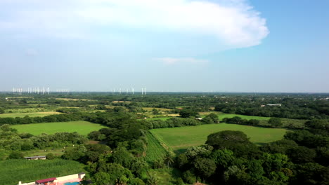 Aerial-view-of-a-wind-turbines-park-near-the-city-of-Oaxaca-in-Mexico,-filmed-by-a-drone-with-vertical-displacement