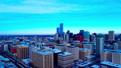 Aerial-panoramic-fly-over-downtown-Edmonton-East-to-West-in-Alberta-Canada-where-snow-covers-all-the-buildings-overlooking-residential-commercial-towers-while-road-work-continue-to-construction2-2