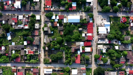 Aerial-view-of-Oaxaca's-poor-neighbourhood-filmed-by-a-drone-with-top-down-displacement,-showing-shack-homes