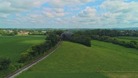 A-Drone-View-Passing-Thru-Smoke-and-Seeing-Amish-Farmlands-on-a-Sunny-Summer-Morning