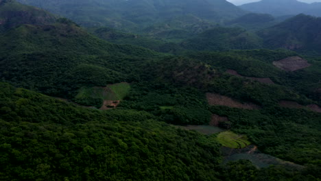 Aerial-view-of-the-mountains-near-the-city-of-Oaxaca,-Mexico,-filmed-by-a-drone-with-tilt-up-displacement