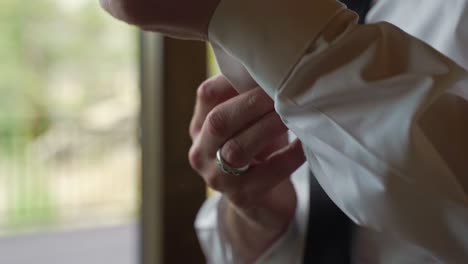 Groom-In-White-Dress-Shirt-Adjusting-Fixing-His-Sleeve-Cufflinks
