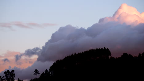 Timelapse-of-Winter-clouds-forming-on-a-mountain-at-sunset
