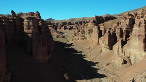Cinematic-drone-shot-going-through-the-Charyn-Canyon-ravine-in-Kazakhstan