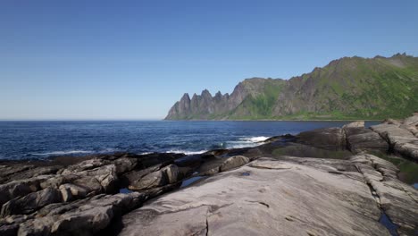 Rocky-Beach-on-Senja-in-Norway-flying-over-Beach-and-sea-droneshot