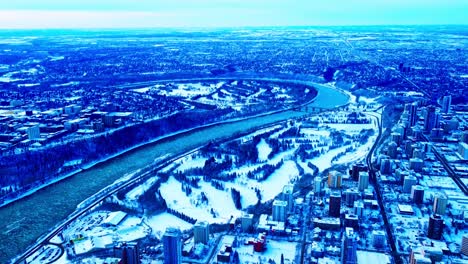 Massive-altitude-over-Downtown-Westside-most-prestigious-residential-high-rise-community-from-109-to-126th-street-NW-flyover-winter-snow-covered-parks-buildings-next-to-the-river-valley-residence-Q1-3