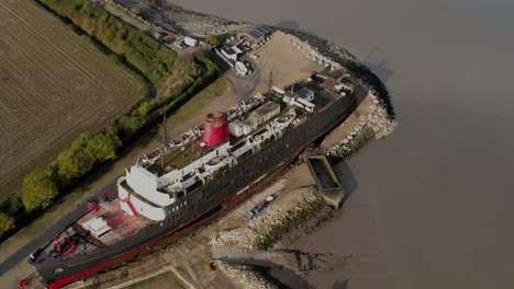 Aerial-View-Of-TSS-Duke-Of-Lancaster,-Former-Railway-Steamer-Passenger-Ship-Beached-Near-Mostyn-Docks-In-North-Wales