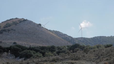 Wind-Turbines-On-The-Scenic-Mountains-Near-Agia-Kyriaki-beach-In-Zola-Village,-Kefalonia,-Greece