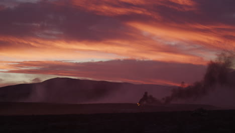 Dramatic-Orange-Sky-During-Sunset-Over-Smoky-Battlefield
