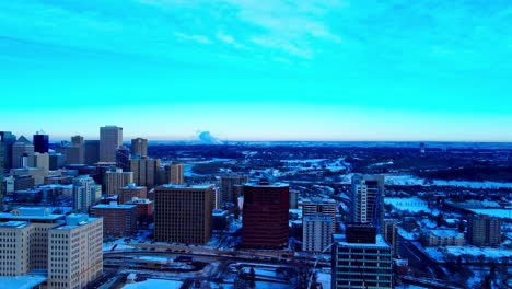 Aerial-panoramic-fly-over-downtown-Edmonton-East-to-South-in-Alberta-Canada-where-snow-covers-all-the-buildings-overlooking-residential-commercial-towers-Walter-Dale-Bridge-light-reno-construction2-2