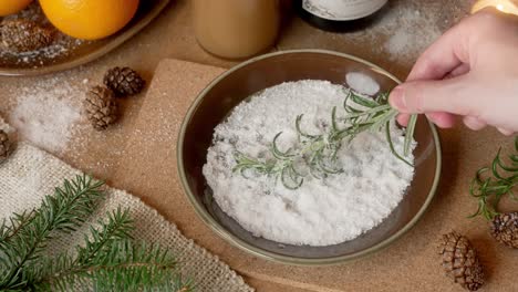Hand-dipping-twig-rose-marry-spice-spices-bowl-sugar-unhealthy-Christmas-winter-snack-dessert-drink-preparations-preparing-guest-visiting-family-gathering-celebration-party-mix-vegetable-sweet-baking
