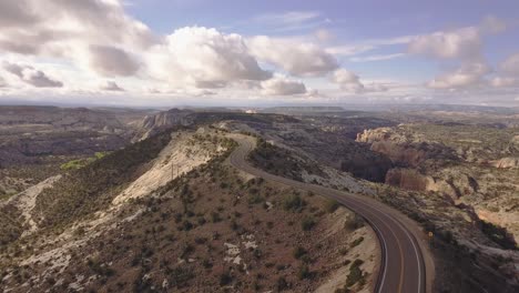 establishing-drone-shot-with-the-camera-slowly-turning-downwards-over-All-American-Road-state-route-scenic-byway-12-in-the-Grand-Staircase-Escalante-National-Monument-in-Utah,-USA-in-4k