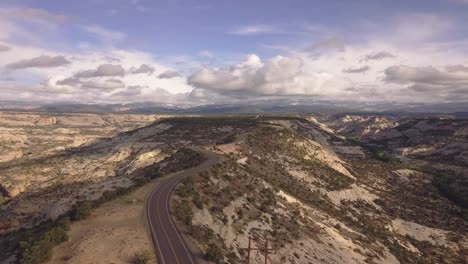 Establishing-drone-shot-over-All-American-Road-state-route-scenic-byway-12-in-the-Grand-Staircase-Escalante-National-Monument-in-Utah,-USA-in-4k