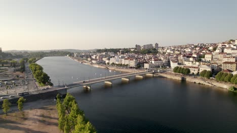 Santa-Clara-bridge,-Modego-river-and-Coimbra-cityscape,-Portugal