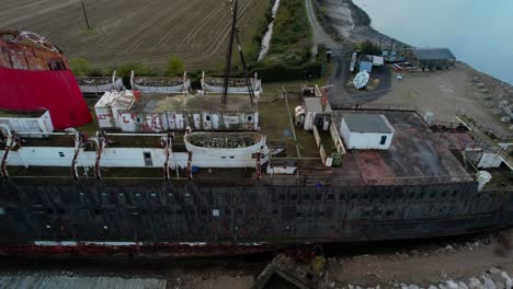 The-TSS-Steam-Ship,-Duke-of-Lancaster-Beached-near-Mostyn-Docks,-on-the-River-Dee---aerial-drone-shot