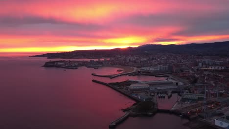 Aerial-epic-sunset-over-gijon-city-in-north-Spain-cloudy-colourful-sky,-Europe-travel-destination