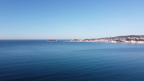 drone-soaring-over-the-beautiful-big-bay-of-Bandol-in-the-south-of-france,-calm-and-sunny-weather
