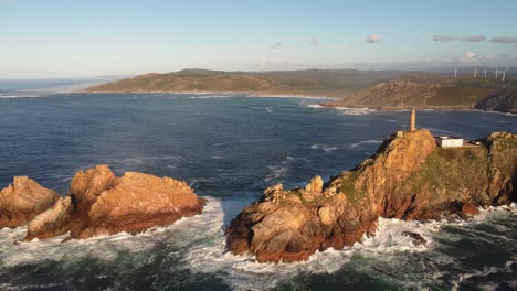 Aerial-view-of-ocean-cliff-rock-bound-coastline-north-of-Spain-Galicia-region-Cabo-vilan-lighthouse-tourist-destination