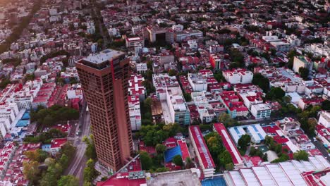 Aerial-flying-over-Benito-Juarez-near-Torre-Axa-tower-at-Mexico-city