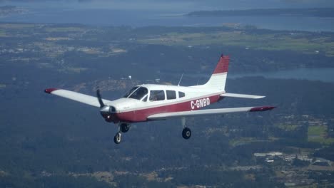 Piper-Aircraft-PA-28-Warrior-Flying,-Shot-from-Other-Airplane