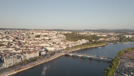 Mondego-River-and-Santa-Clara-bridge-with-Coimbra-University-town-in-background,-Portugal