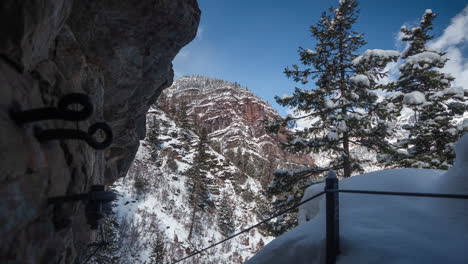 Timelapse,-Ouray,-Colorado,-Switzerland-of-America,-Snow-Capped-Hills-and-Trees-by-Hiking-Trail-on-Sunny-Winter-Day