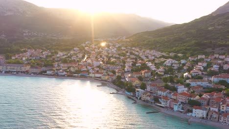 Aerial-truck-shot-of-a-quiet-village-on-Krk-Island-Croatia-early-in-the-morning