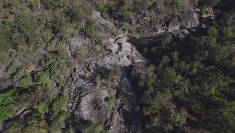Aerial-Over-Vegetated-Gigantic-Boulders-And-Creek-At-Granite-Gorge-Nature-Park-In-Mareeba,-Queensland,-Australia