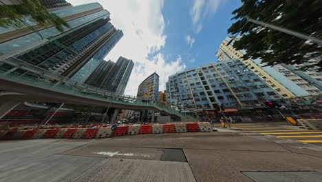 Kwun-Tong-Redevelopment,-Motion-Timelapse-of-Kwun-Tong-Hip-Wo-Street-new-Bridge,-new-and-old-buildings,-Tong-Lau