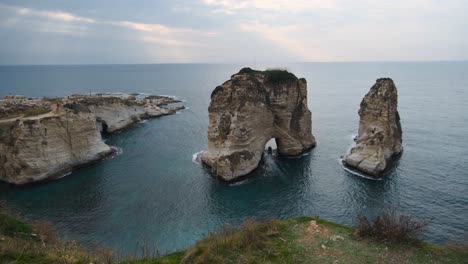 Excursion-boat-off-the-Pigeons-Rock,-Grotte-aux-Pigeons,-in-Beirut,-Lebanon