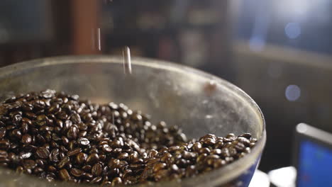 Coffee-beans-pouring-from-hand