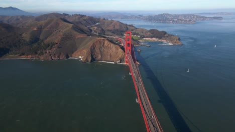 Aerial-view-overlooking-the-Golden-gate-bridge,-in-sunny-San-Francisco,-USA---reverse,-drone-shot
