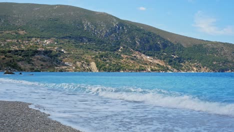 Blue-Ocean-Waves-Crashing-On-Shore-At-Agia-Kiriaki-Beach-In-Greece---wide,-static-shot