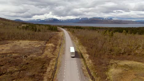 Drone-footage-follows-a-truck-in-autumn-in-north-of-Sweden