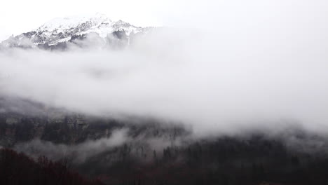 Swiss-alps-cloudy-timelapse-on-a-cliff-edge