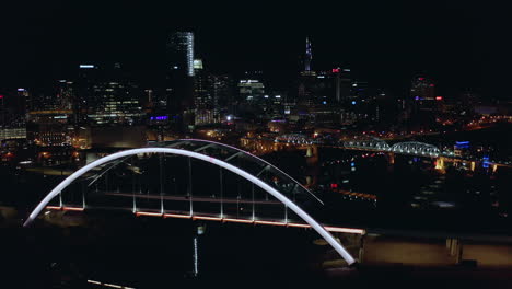 Rising-night-time-aerial-over-Nashville-TN-with-Korean-Veterans-bridge-lights