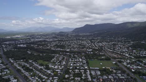 Cairns-City-With-Scenic-Mountains-In-Background-In-Far-North-Queensland,-Australia---aerial-drone-shot