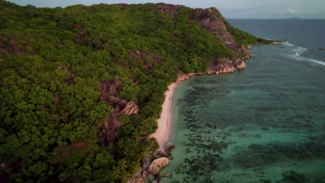 High-Aerial-view-of-coastline-of-La-Digue-Island-in-The-Seychelles-an-sunset