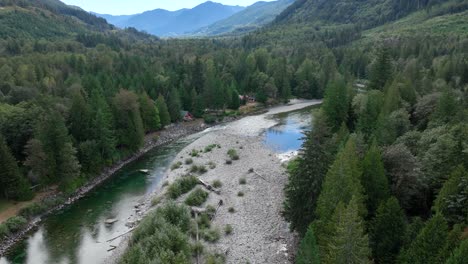 Wide-aerial-view-of-cabins-lining-the-Skykomish-River-in-Washington-State